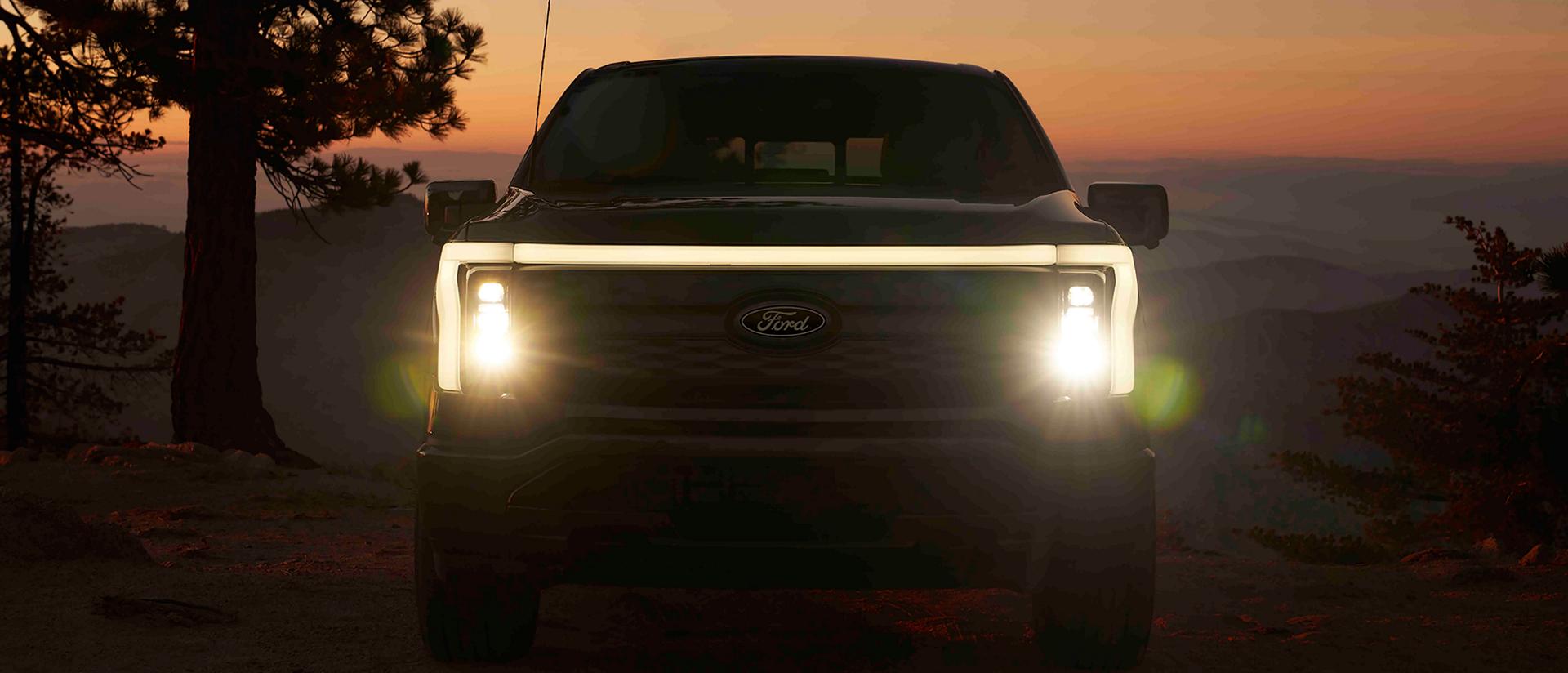 The front fascia of a 2025 Ford F-150® Lightning® pickup, showing the Front Signature Light Bar