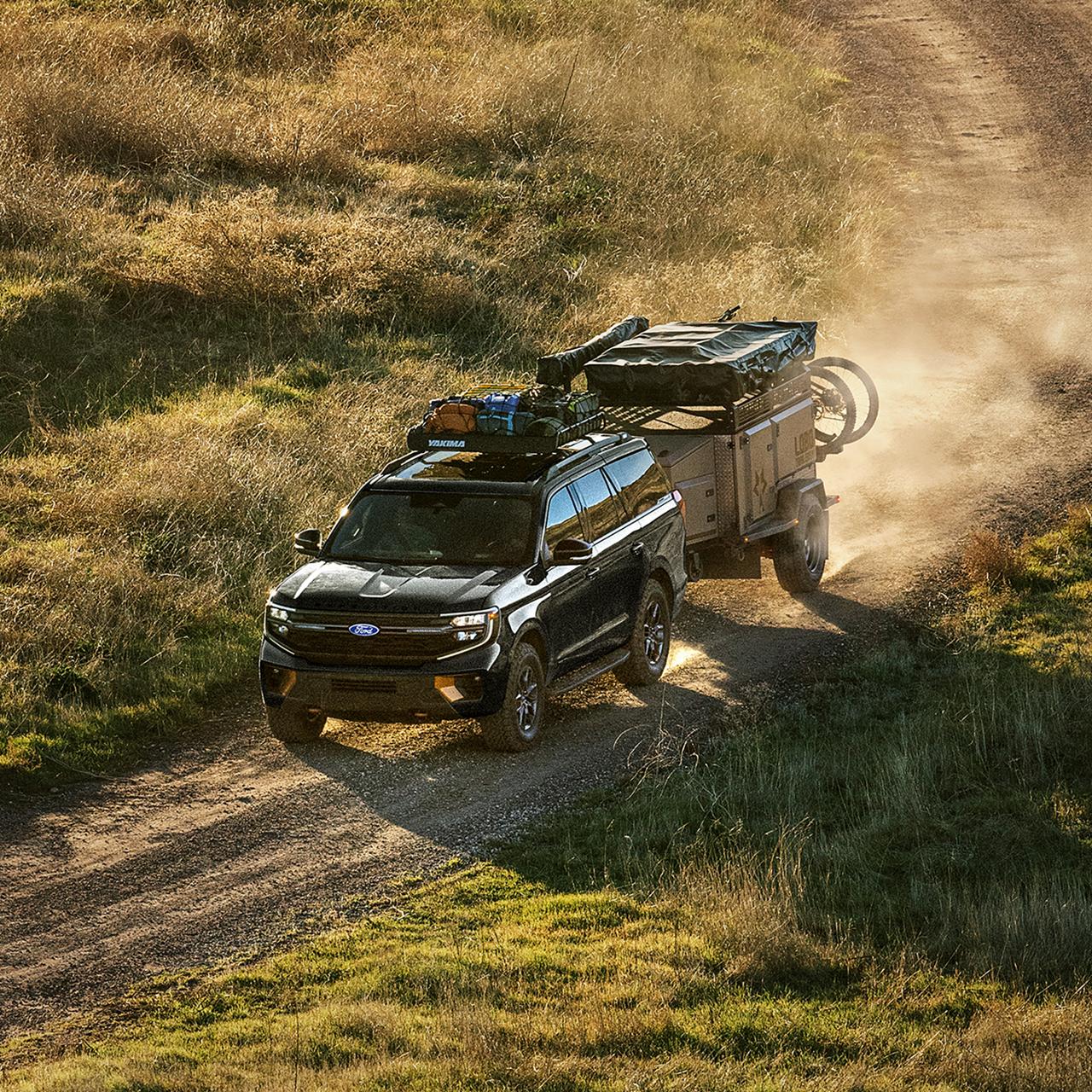 2027 Ford Expedition® Tremor® SUV with optional equipment and available Ford accessories shown towing a trailer