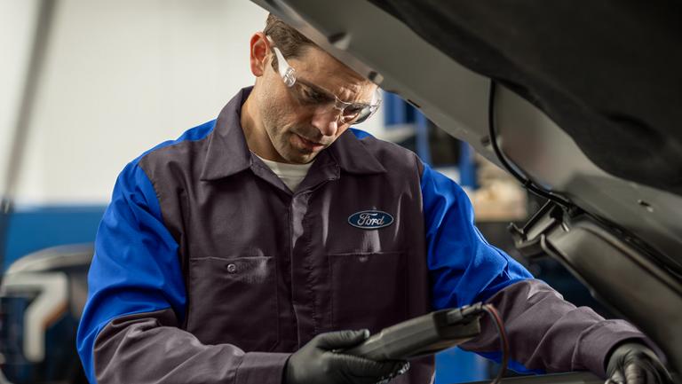A Ford Service tech runs diagnostics