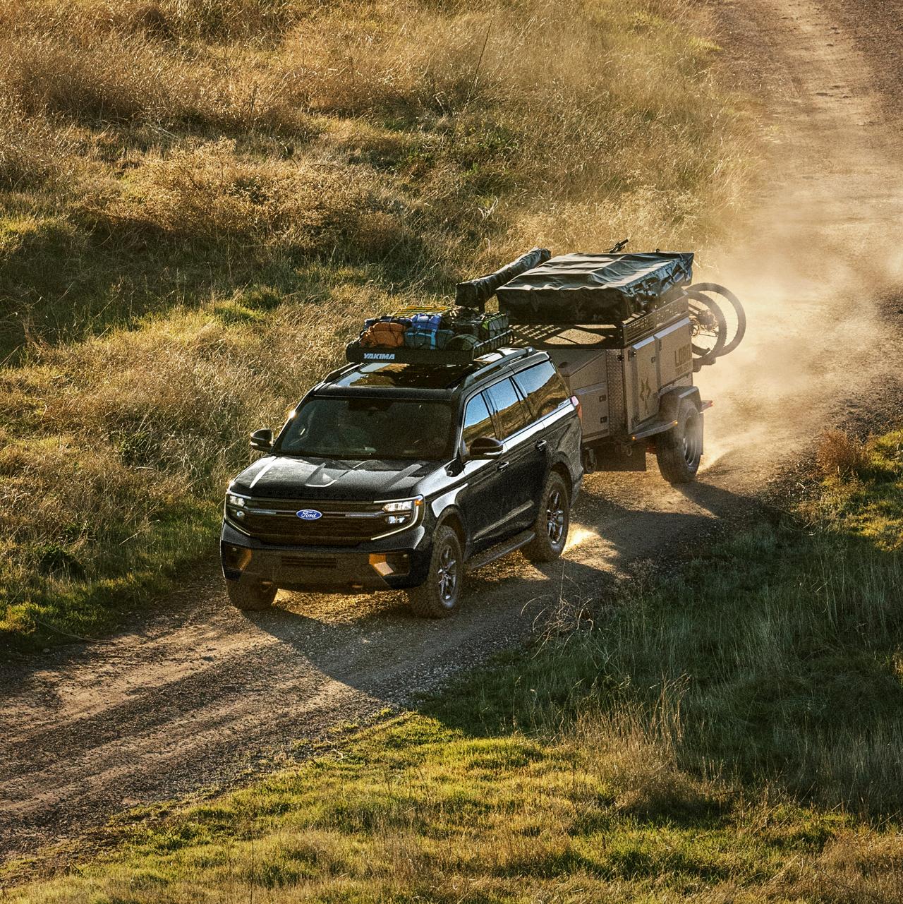 2027 Ford Expedition® Tremor® SUV with optional equipment and available Ford accessories shown towing a trailer