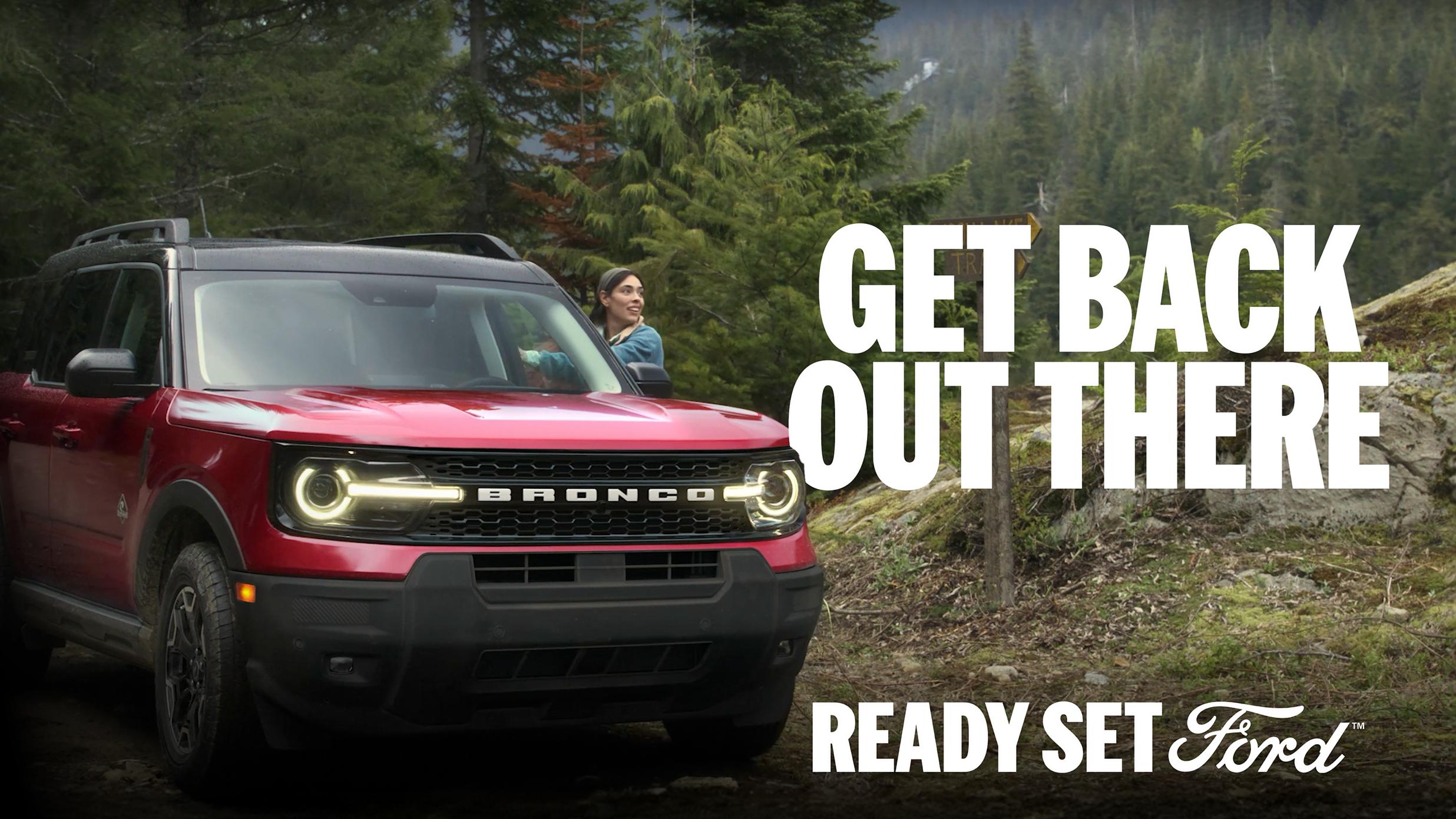 A close up picture of a woman sitting in a chair and staring directly into the camera