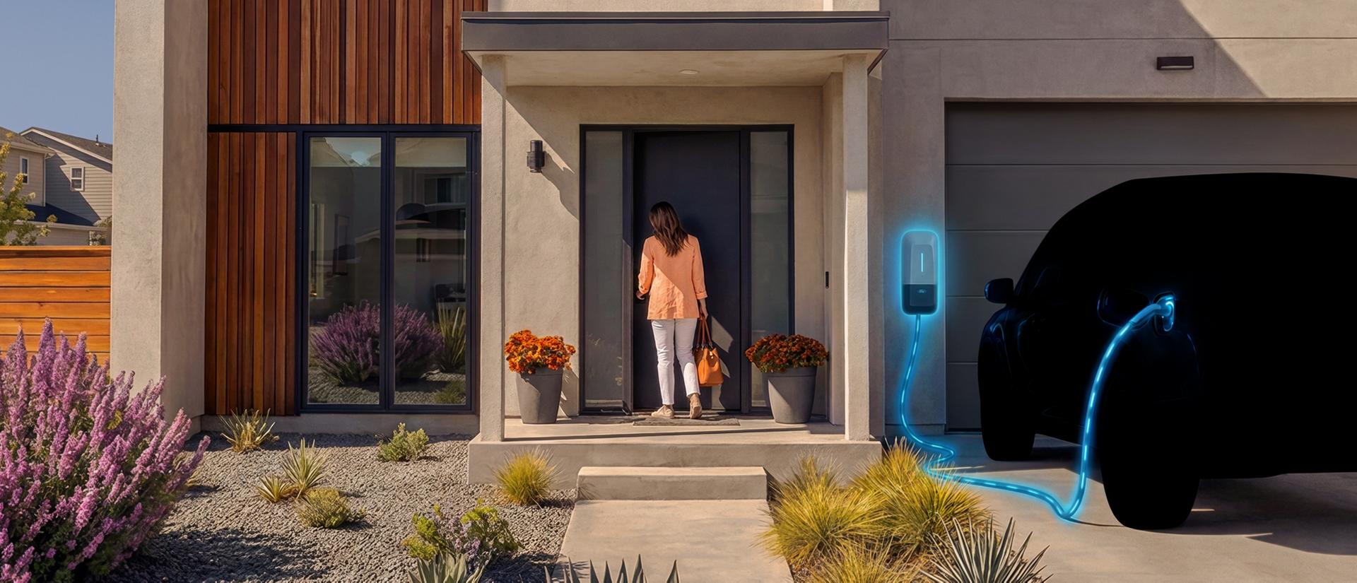A shadowy silhouette of a truck is plugged into a home in the afternoon