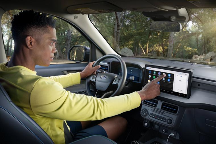 Person using the 13.2-inch center display