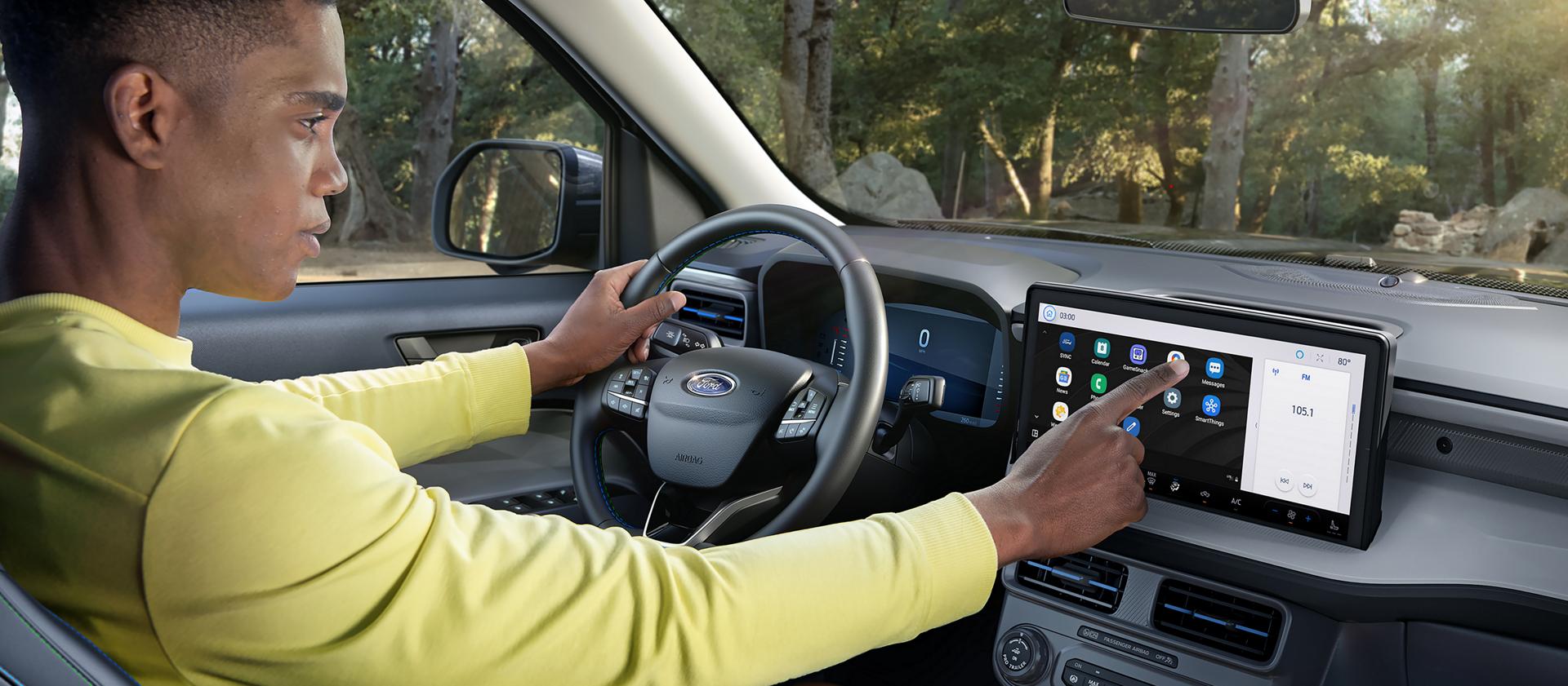 Person using the 13.2-inch center display