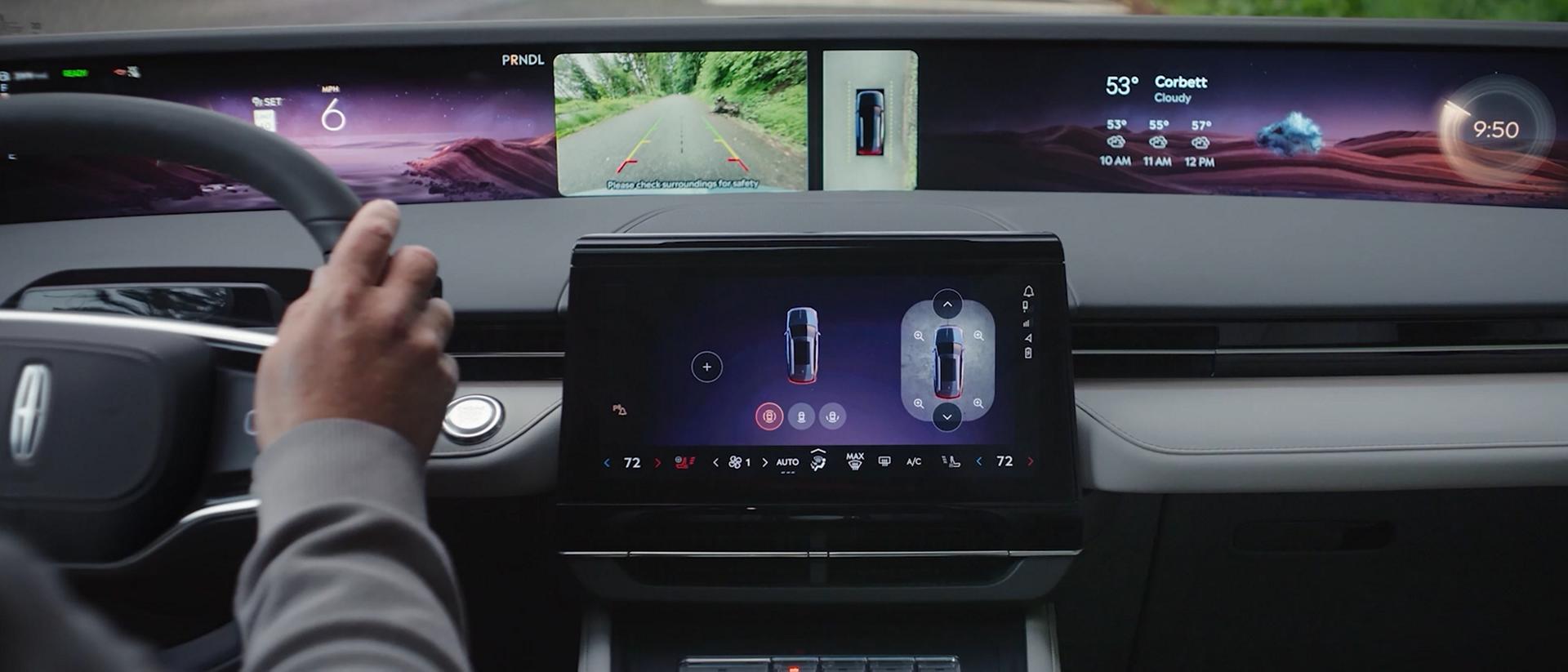The driver of a 2026 Lincoln Nautilus® SUV uses the 360 degree camera to see around the vehicle