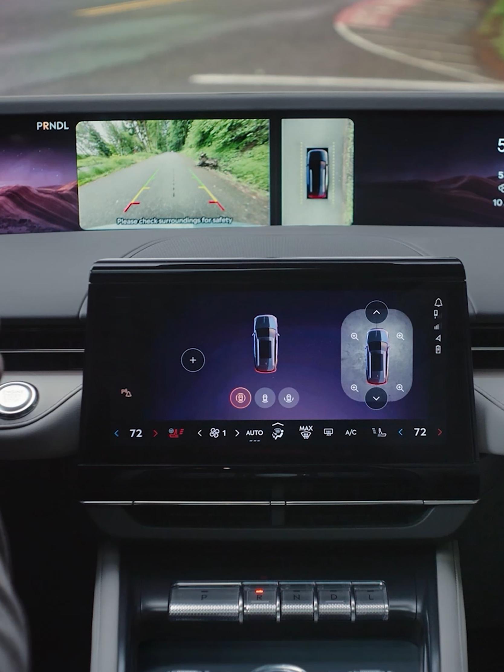 The driver of a 2026 Lincoln Nautilus® SUV uses the 360 degree camera to see around the vehicle