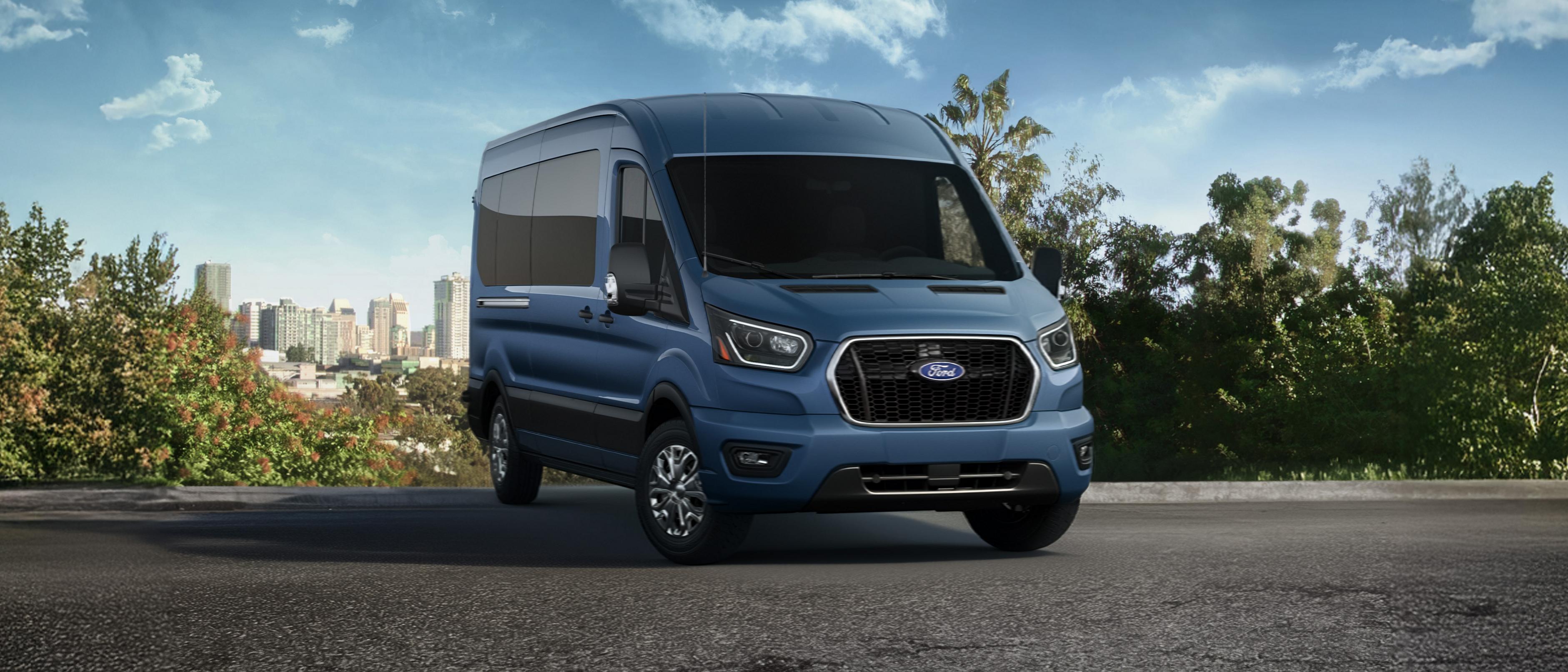 Blue 2026 Ford Transit® van parked overlooking a city horizon
