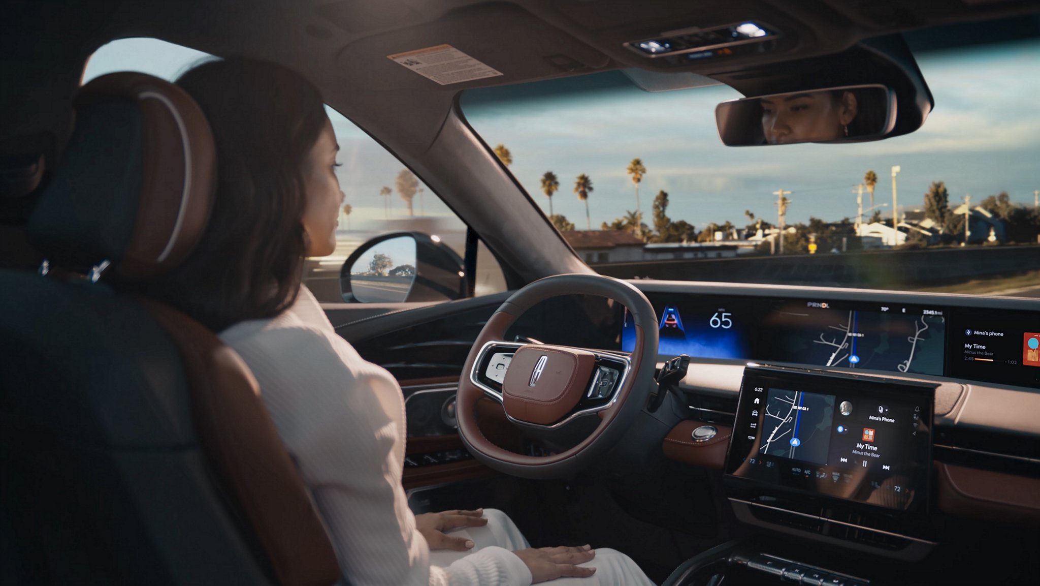 A driver of a 2025 Lincoln Nautilus SUV is shown using hands-free Lincoln  BlueCruise technology on a divided highway