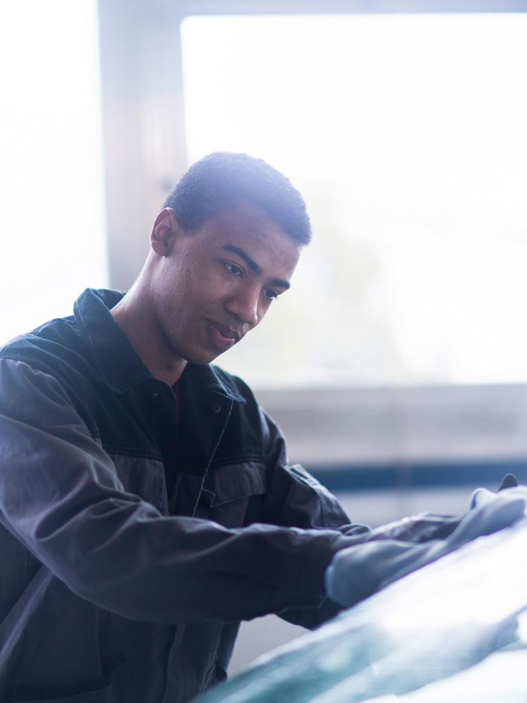 A Ford technician performs a windshield repair