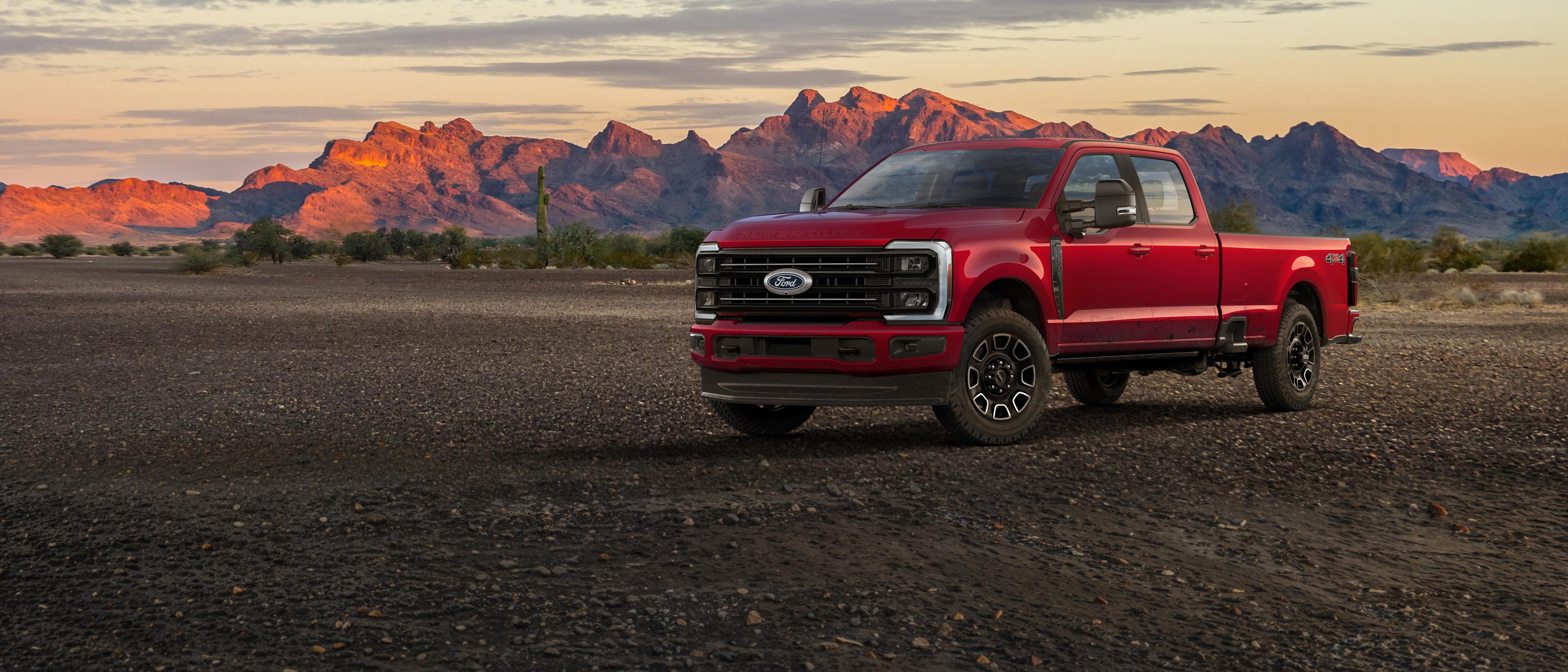 2027 Ford Super Duty® F-350® Platinum® truck parked on a dirt road in the mountains