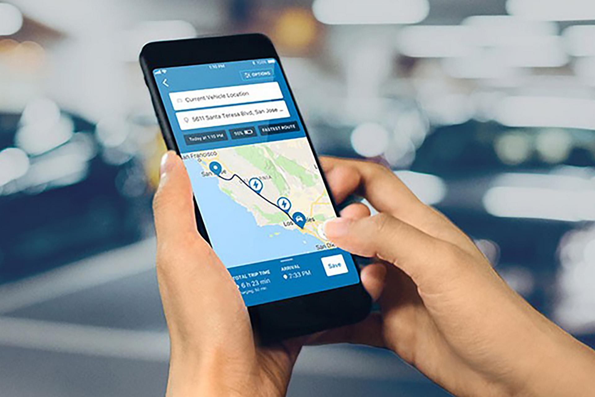 A Ford app screen map displays the availability of public chargers nearby