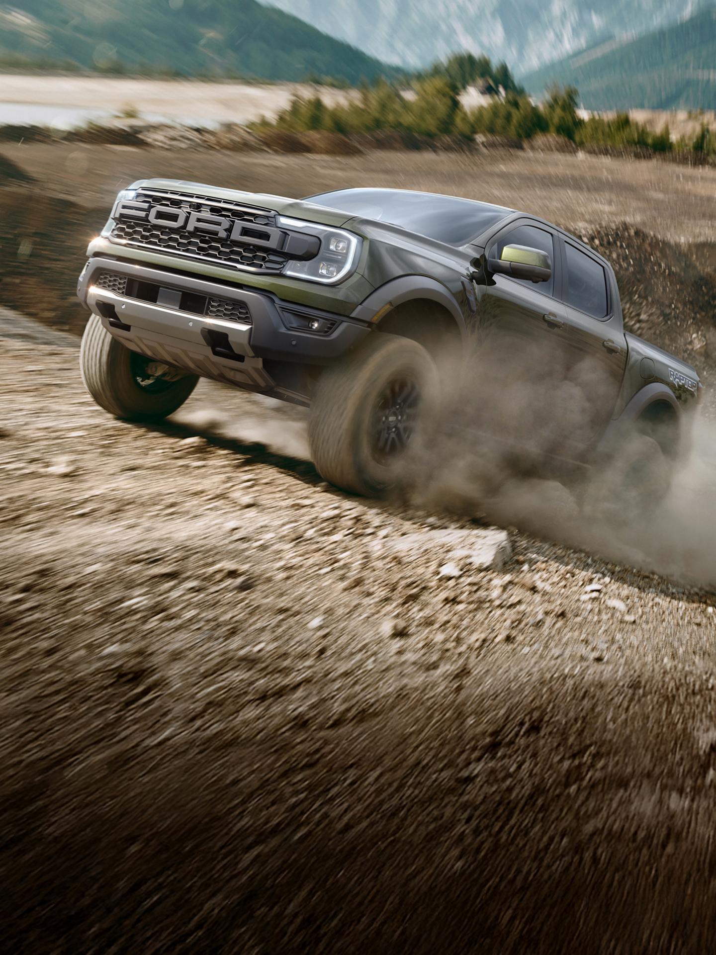 2026 Ford Ranger® Raptor® driving over rough terrain at high speeds in a mountainous desert