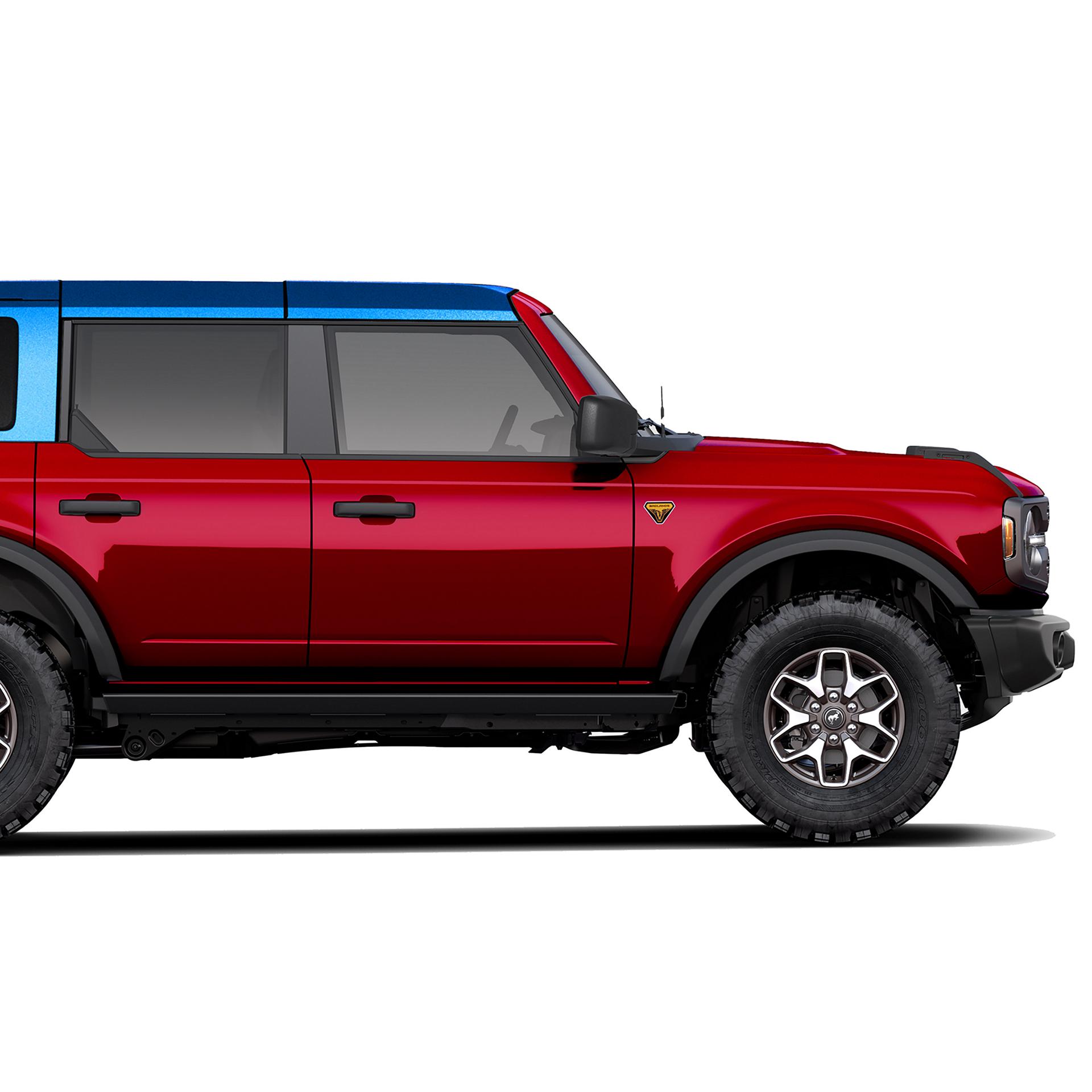 A 2026 Bronco® Badlands in Ruby Red Metallic with a Velocity Blue Metallic-painted roof
