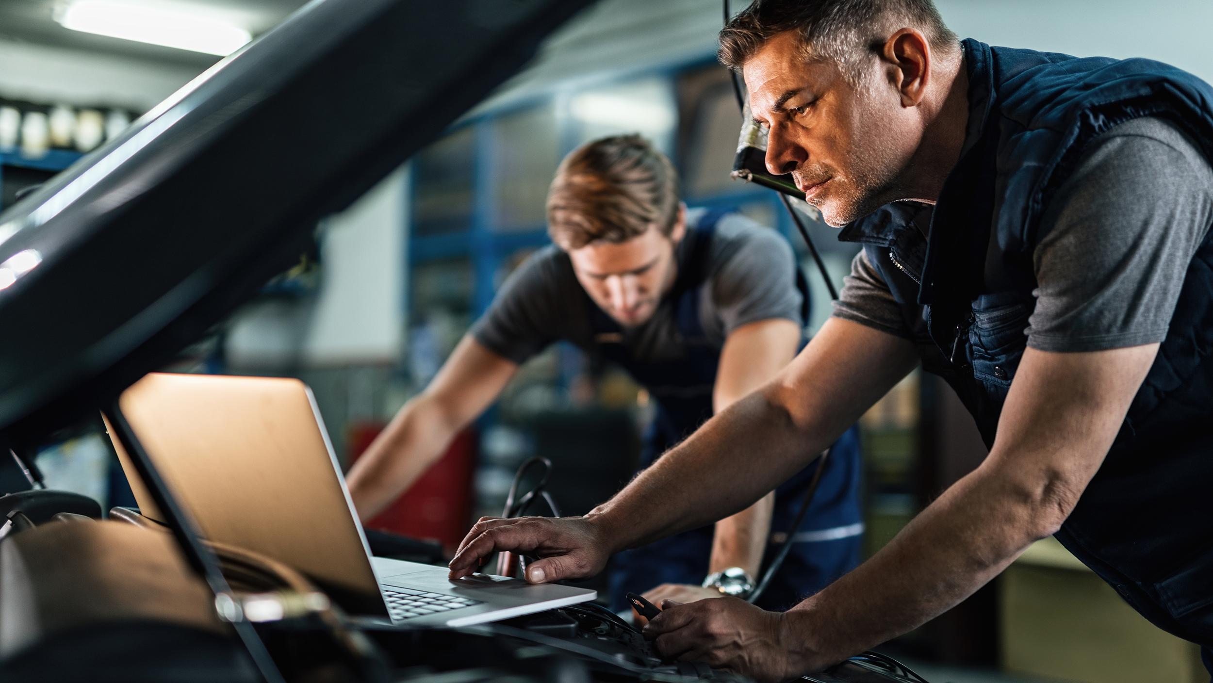 Technicians working on a vehicle