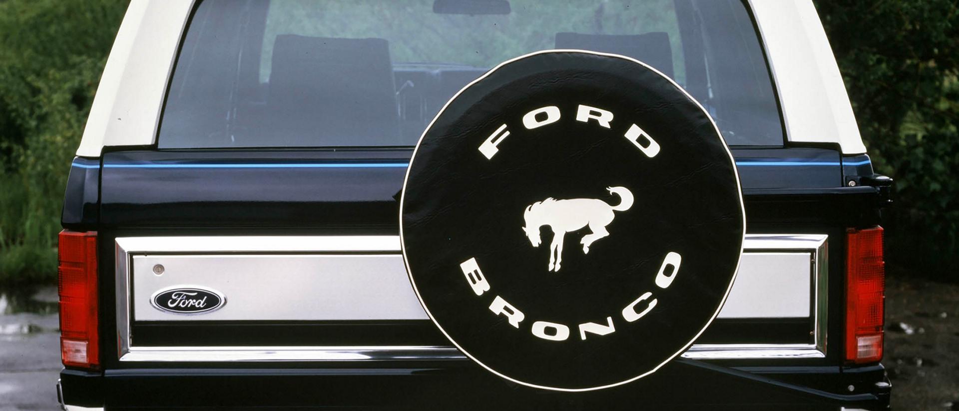 A two-tone 1984 Ford Bronco® model shown from the rear