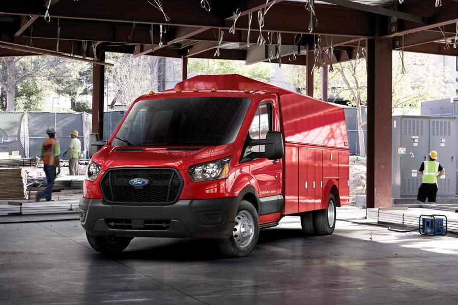 Workers walking near a 2025 Ford Transit® model parked at a jobsite