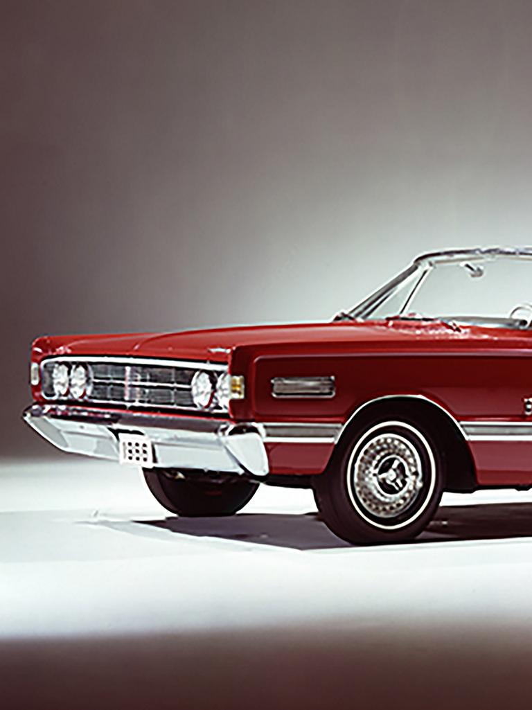 A red 1966 Ford Mercury Park Lane convertible