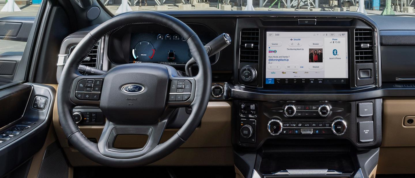 Interior of a 2025 Ford Super Duty® F-350® LARIAT® pickup parked near silos