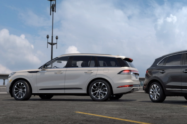 a Lincoln vehicle and another vehicle reversing toward each other is shown here  