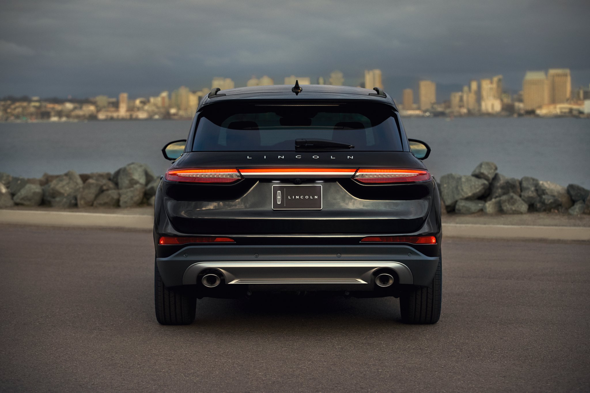 The rear of a 2026 Lincoln Corsair is shown with the LED light bar illuminated