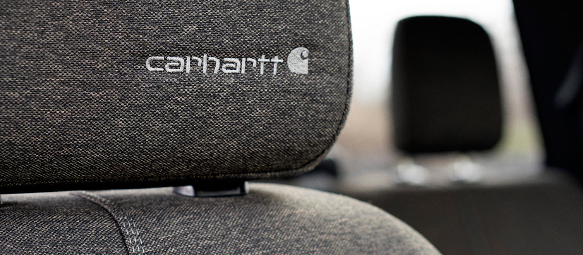 Close up of passenger seat headrest with embroidered Carhartt® logo