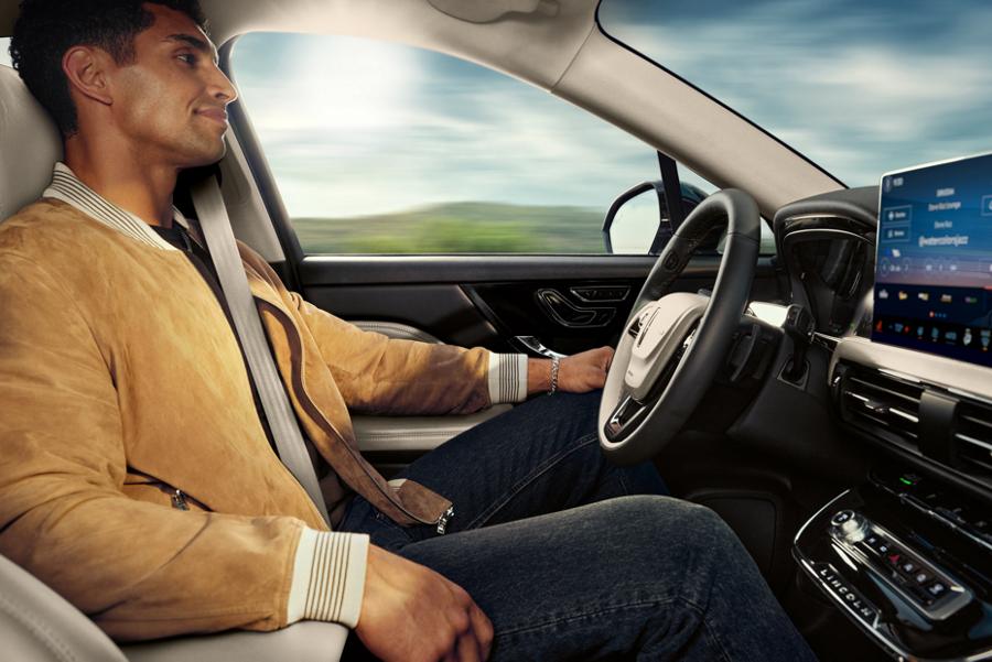 A driver is shown seated in a 2025 Lincoln Corsair® SUV while using hands-free controlled access highway driving