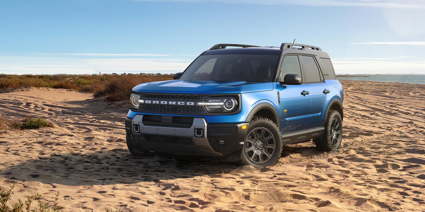 A Blue 2025 Ford Bronco Sport Badlands SUV sitting on a beach.