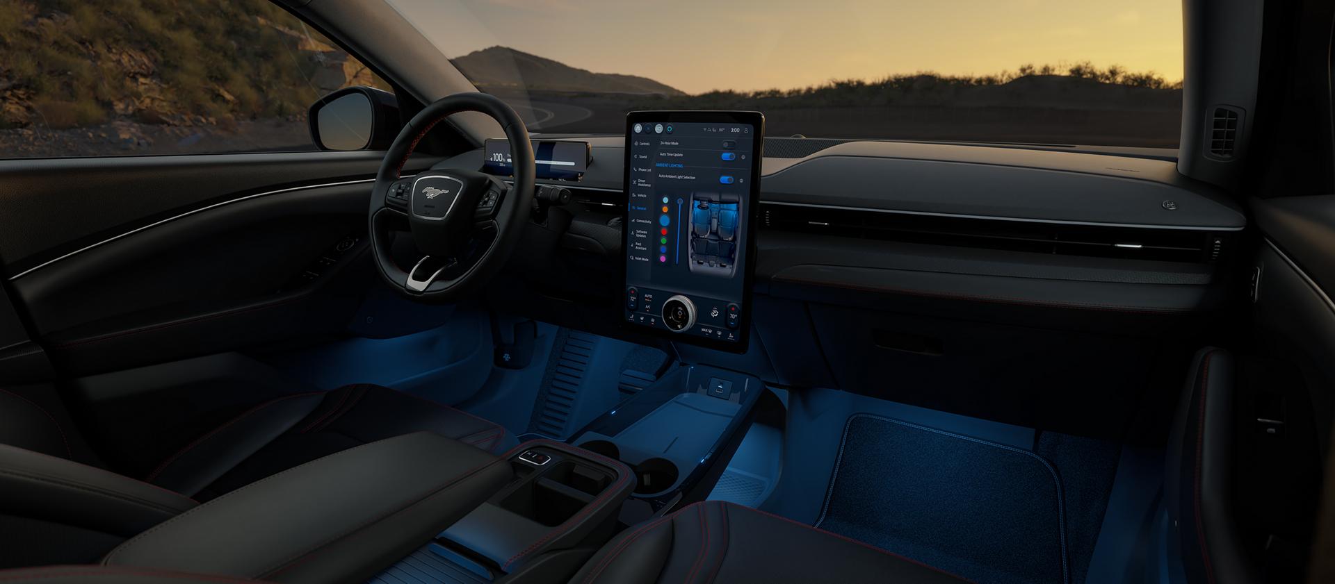 Interior of a 2026 Mustang Mach-E® SUV with a view of the driver's seat, dashboard, and scenic mountain landscape