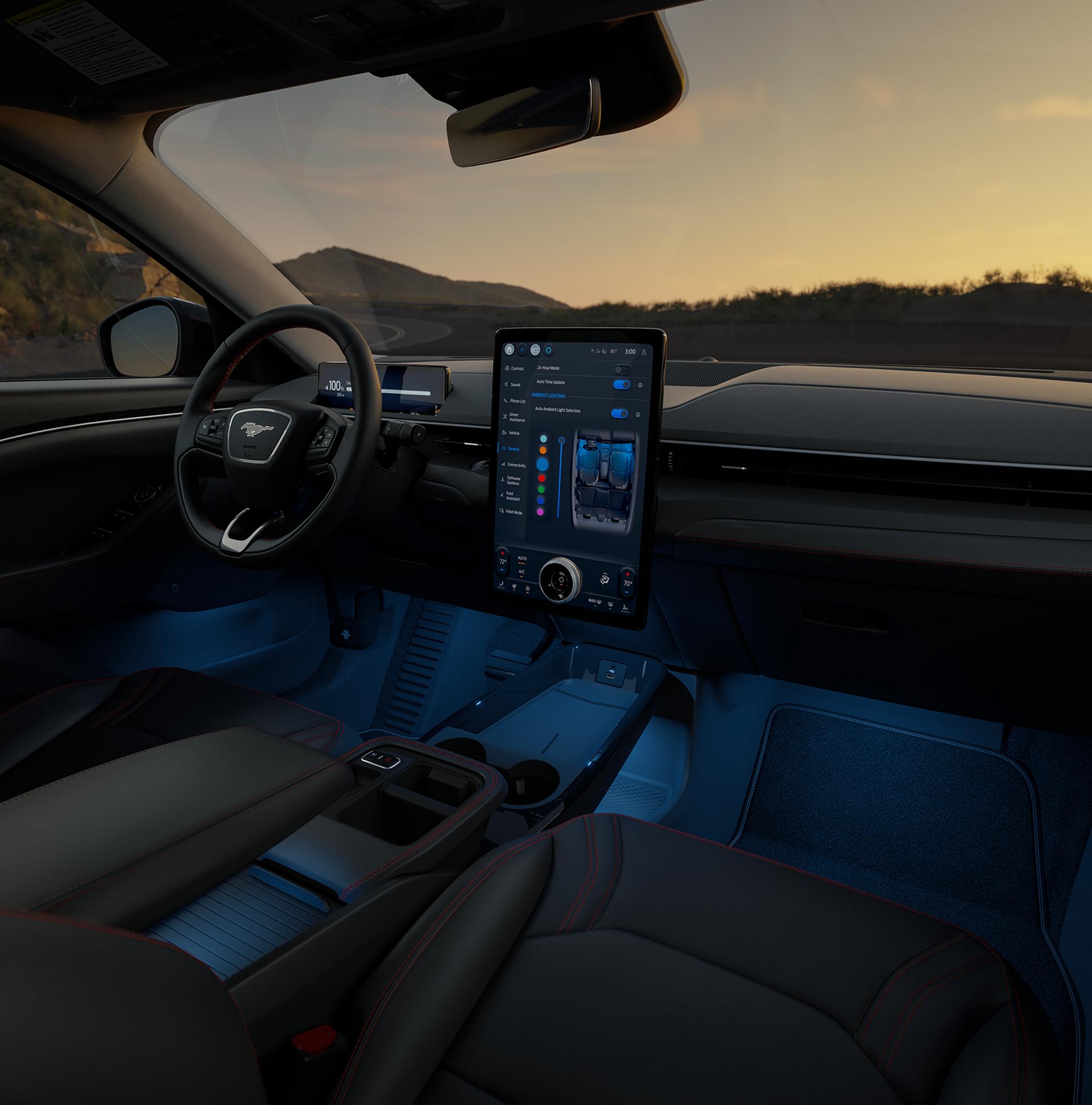Interior of a 2026 Mustang Mach-E® SUV with a view of the driver's seat, dashboard, and scenic mountain landscape