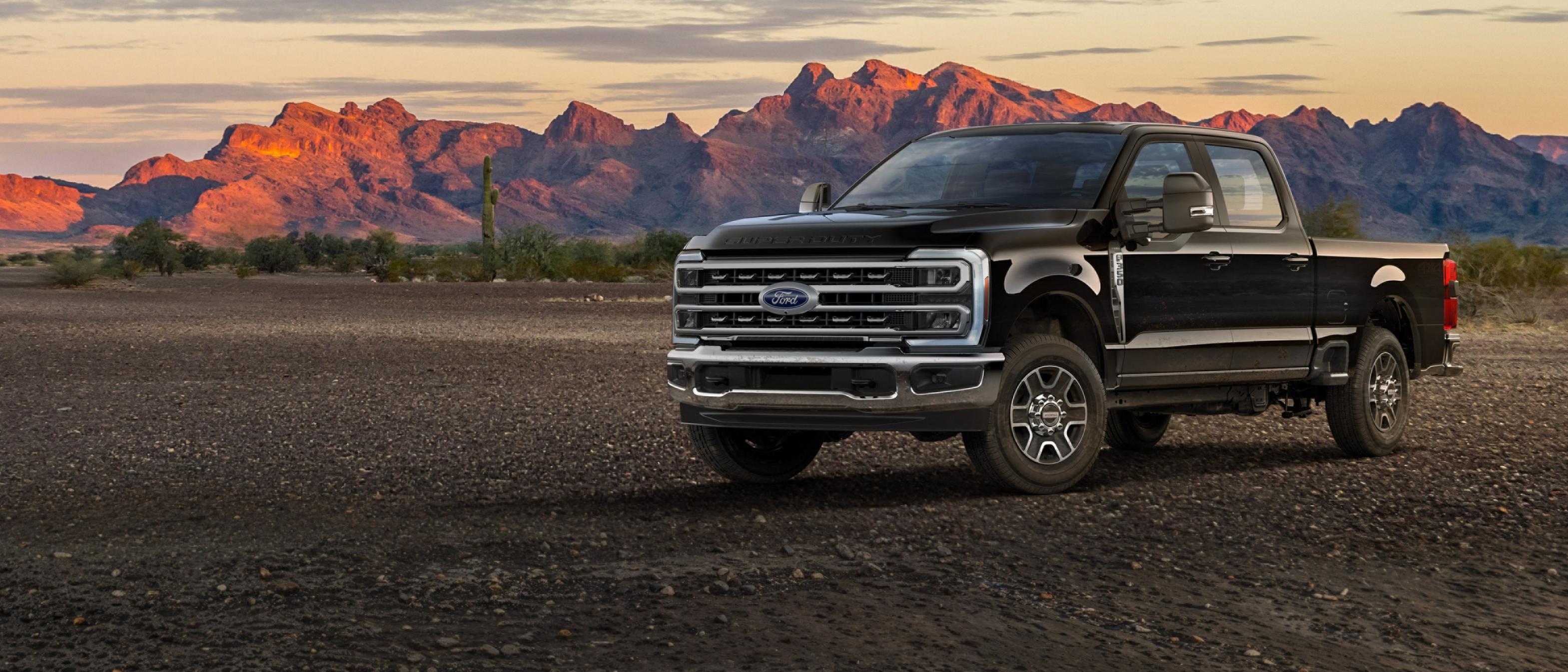 2026 Ford Super Duty® F-350® Lariat® truck parked on a dirt road in the mountains