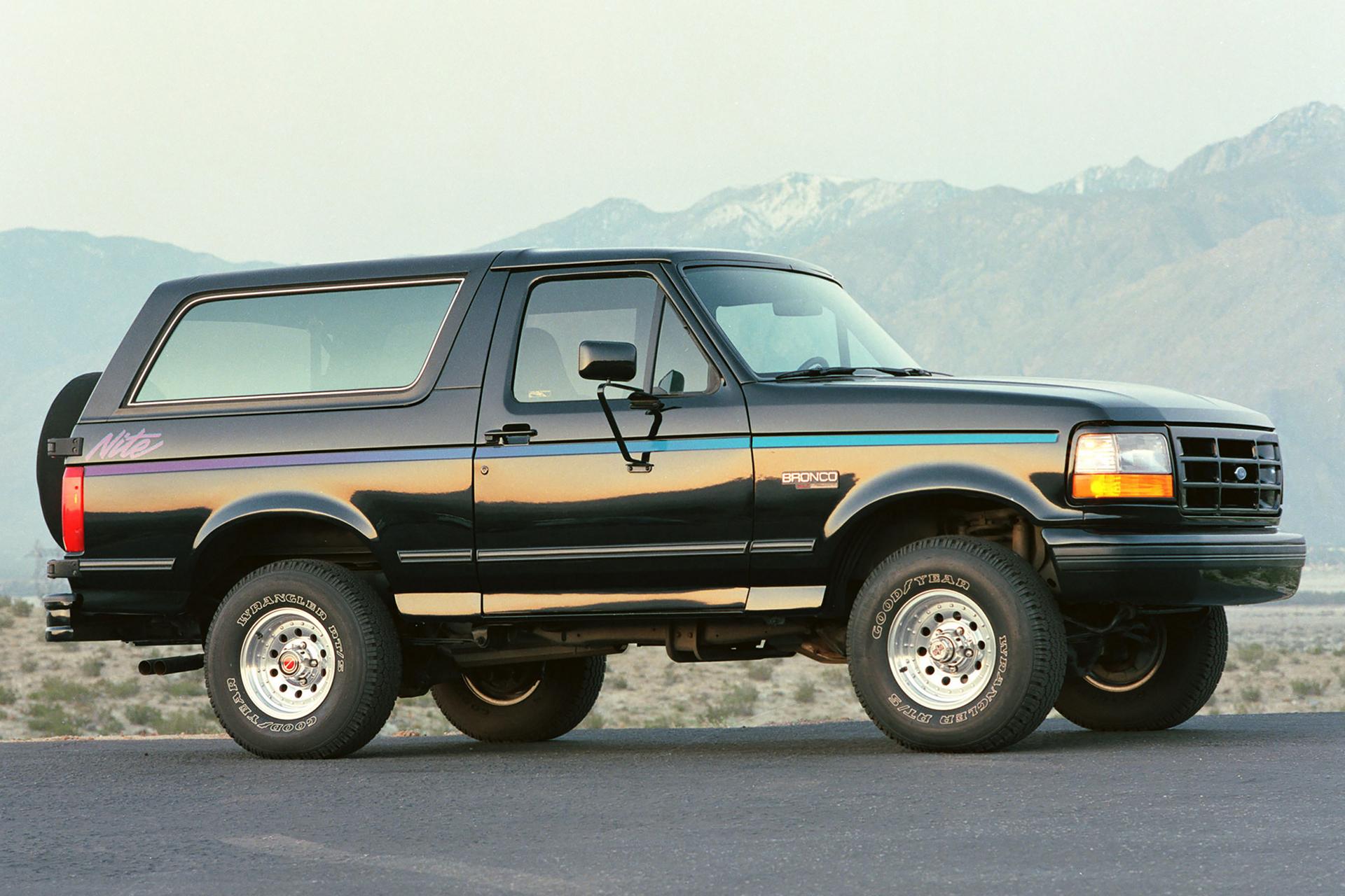 A 1991 Ford Bronco® Nite Edition model parked in front of a mountain landscape