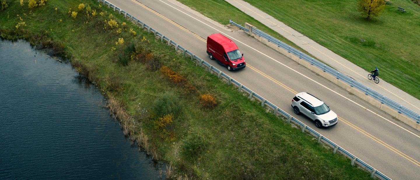 Birds-eye view of a 2025 Ford Transit® van being driven on a highway