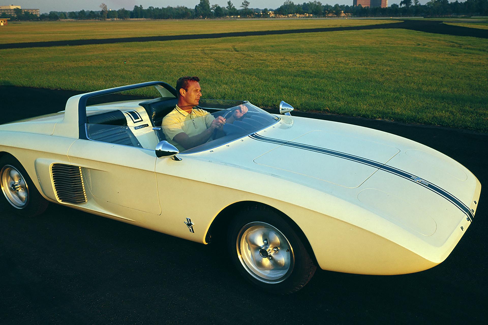 Man driving a Mustang I car