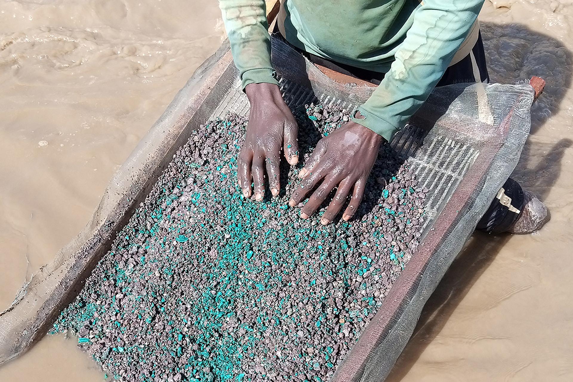 Artisanal miner washing cobalt