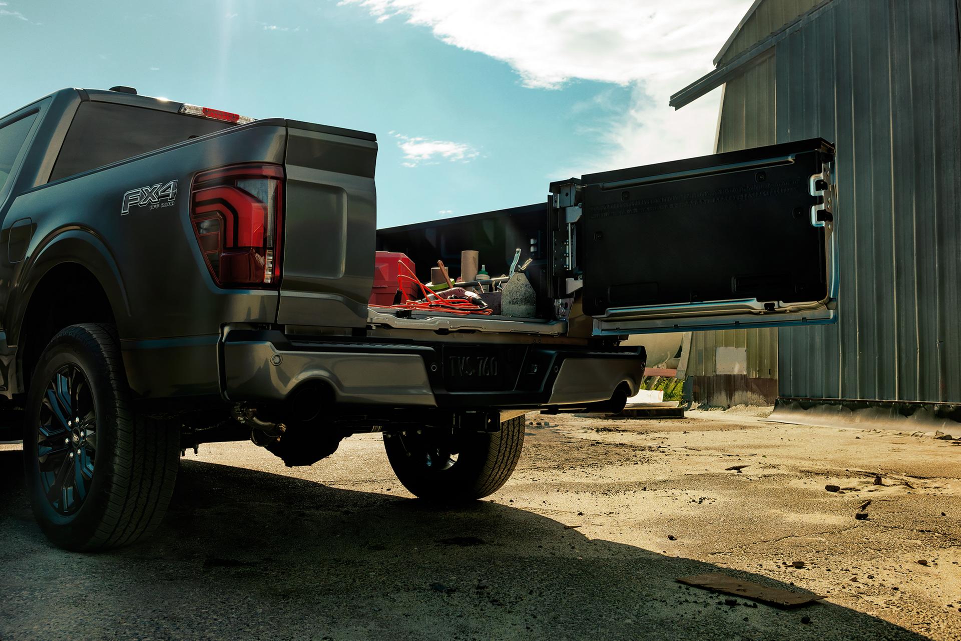 The tailgate of a Ford F-150® Lariat® truck open to show Pro Access Tailgate