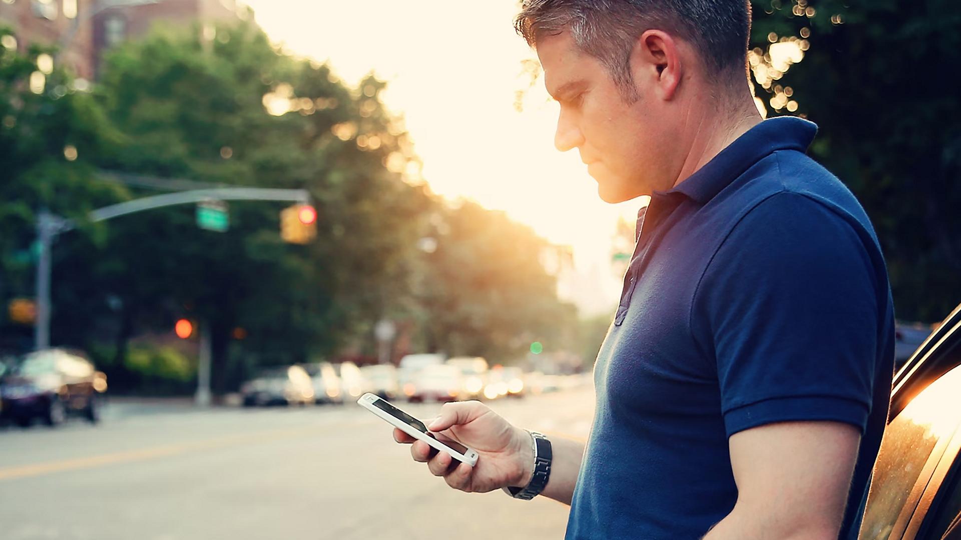 A Ford owner calls for roadside assistance from the side of the road