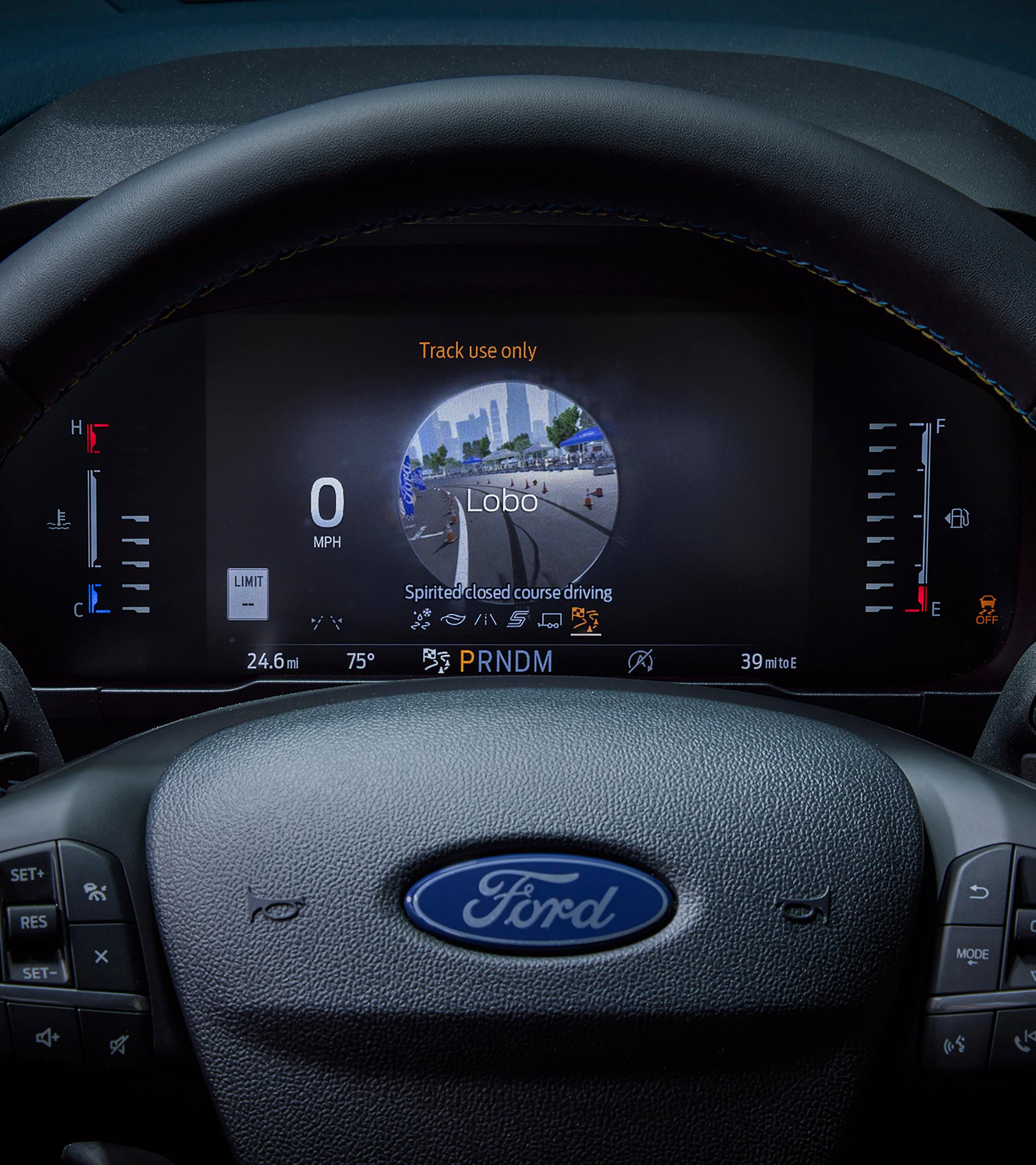 Close-up of the digital instrument cluster highlighting the drive modes