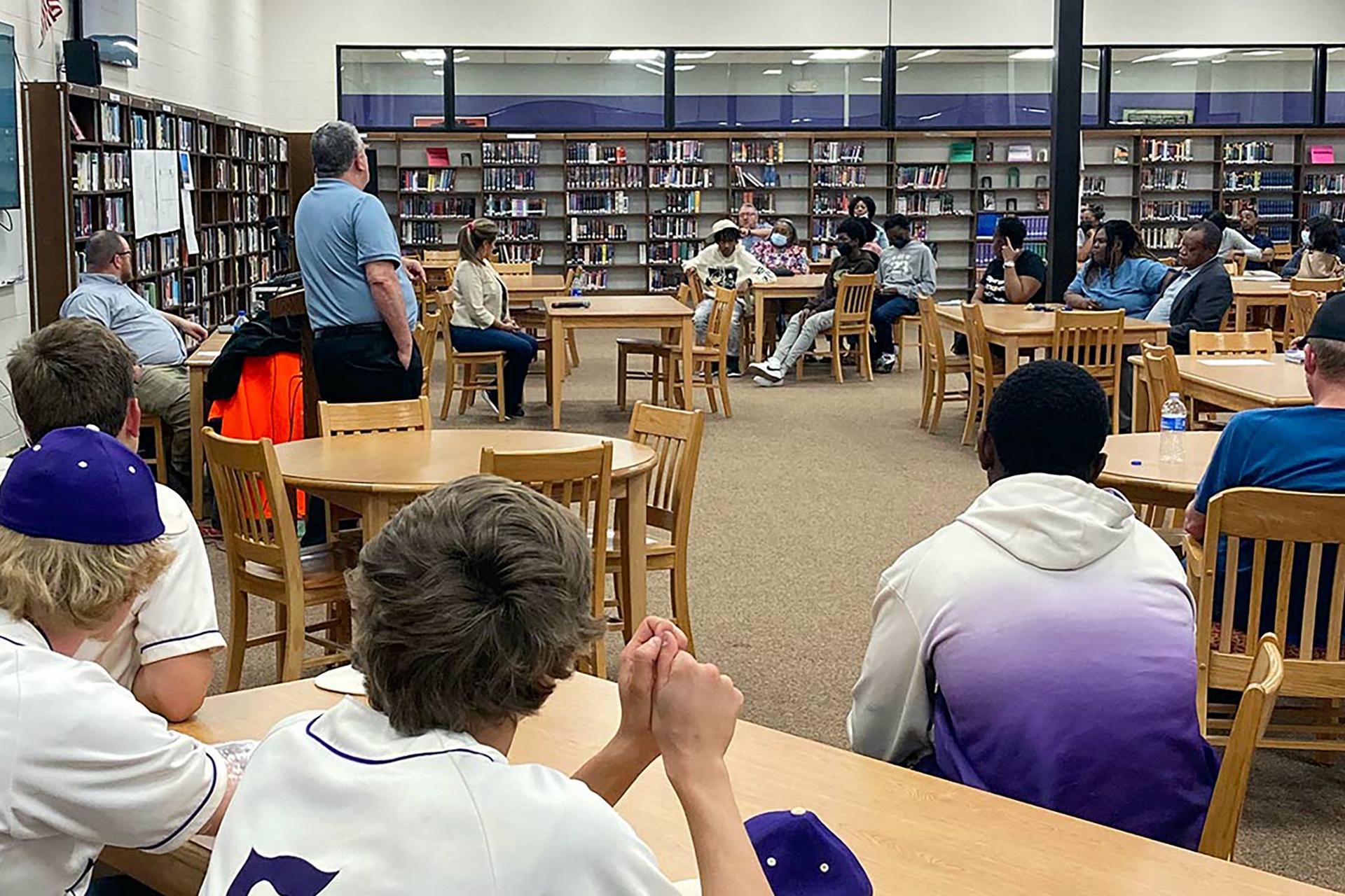 A Ford employee gives a talk in a school library
