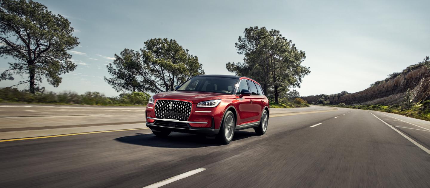 A 2025 Lincoln Corsair® Reserve model is being driven on a remote highway