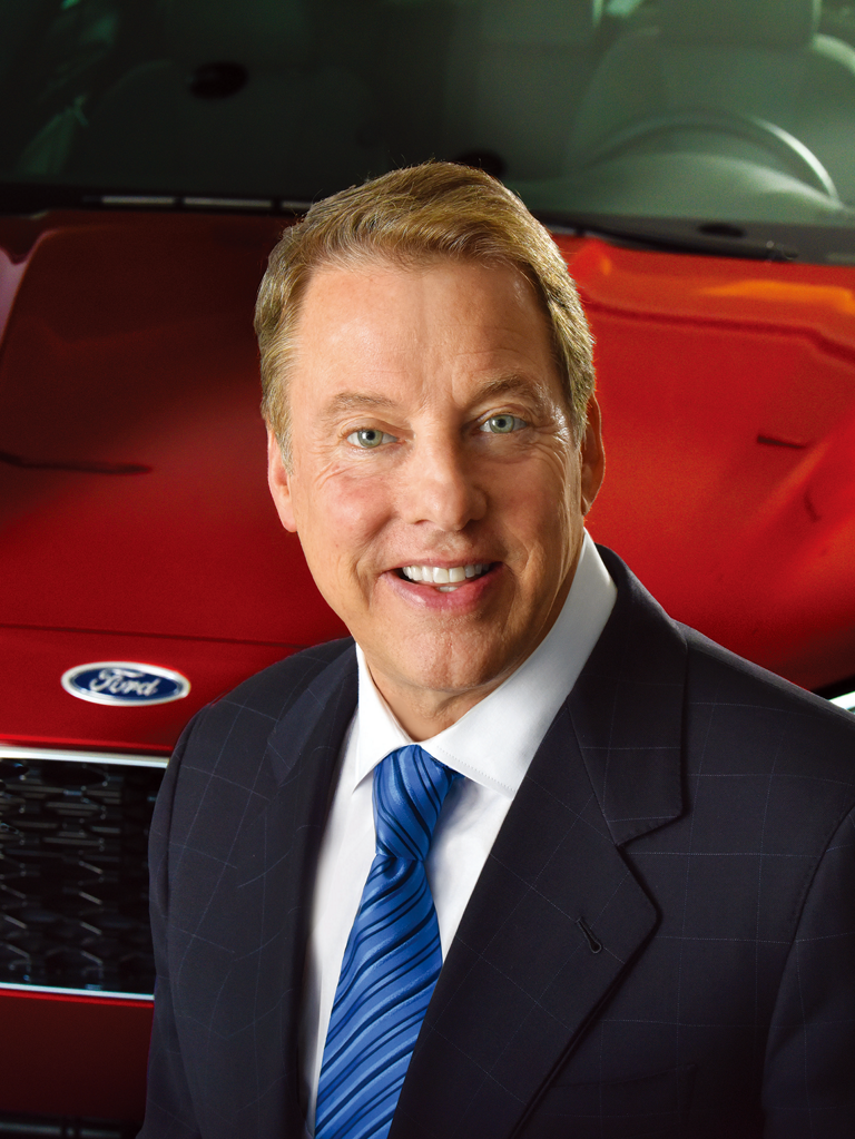 William Clay Ford Jr., at an auto event, smiles to camera