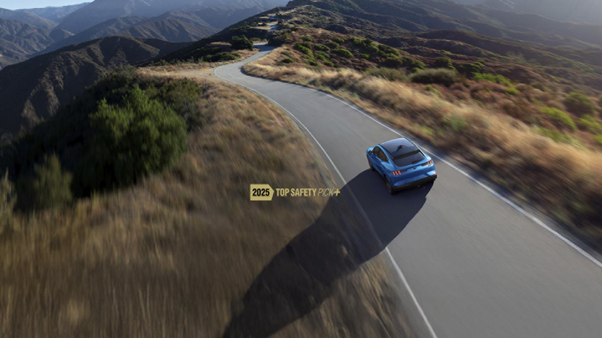 Ford Mustang Mach-E driving along road with IIHS logo overlay