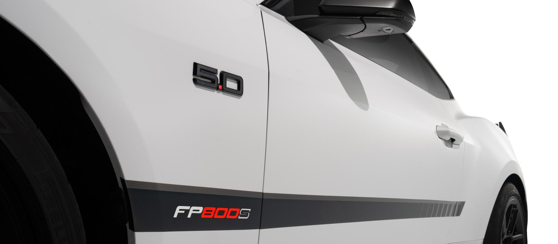 Passenger-side lower bodyside detail with FP800S black graphics and 5.0L fender badge
