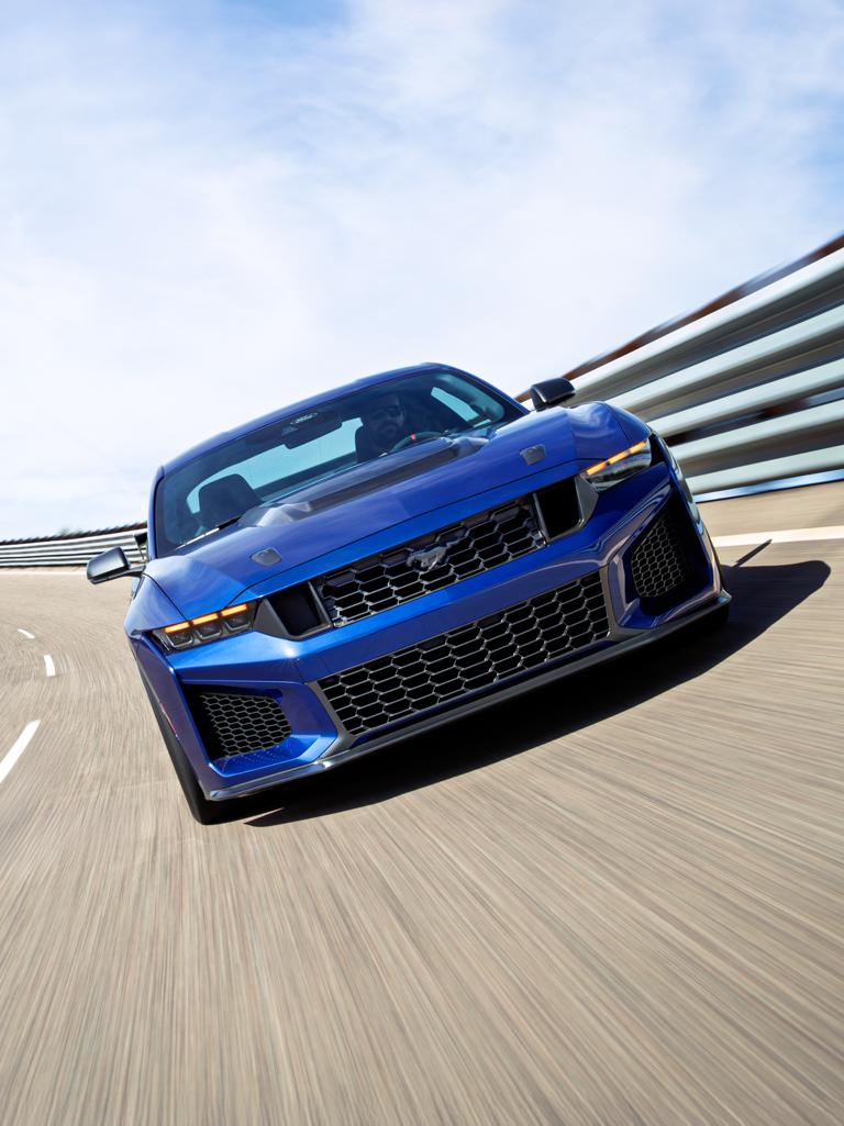 A white 2026 Ford Mustang® on a professional racetrack