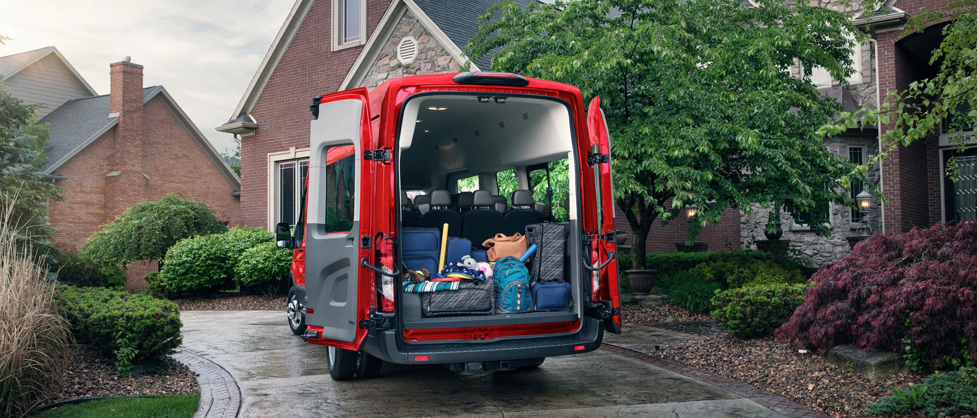 A 2026 Ford Transit® van rear view with supplies loaded in the van