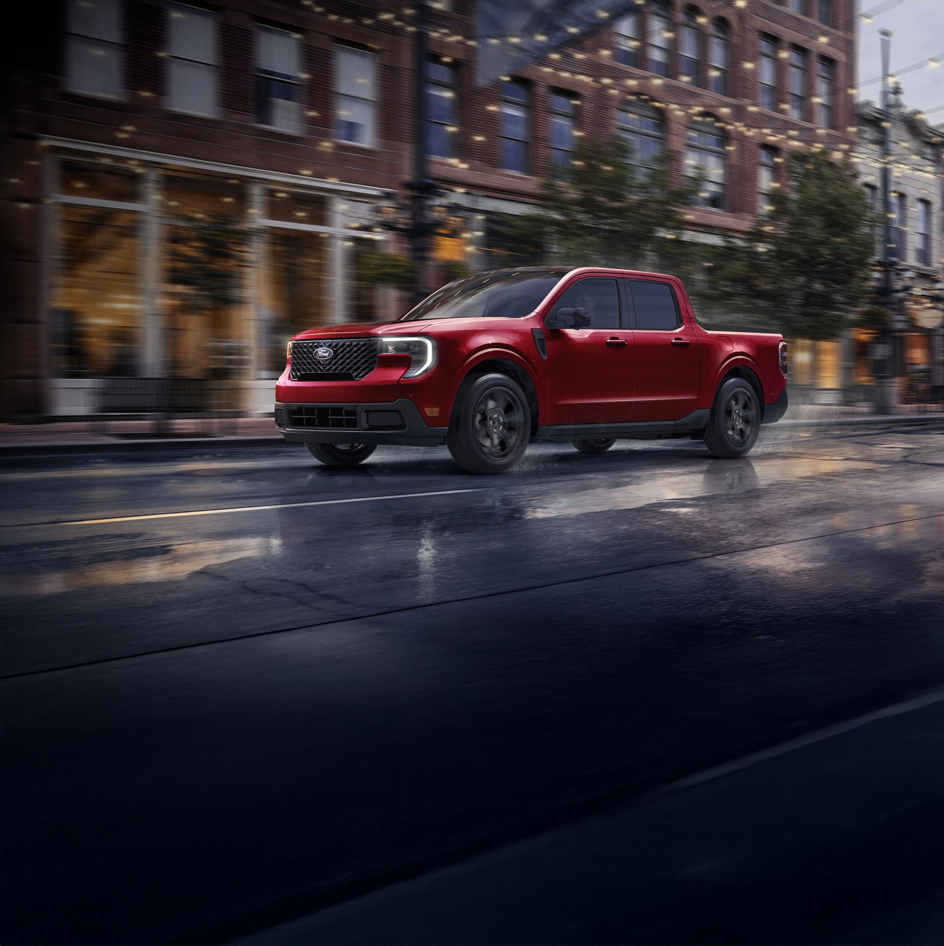 2026 Ford Maverick® pickup with Black Appearance Package being driven on a city street in the evening