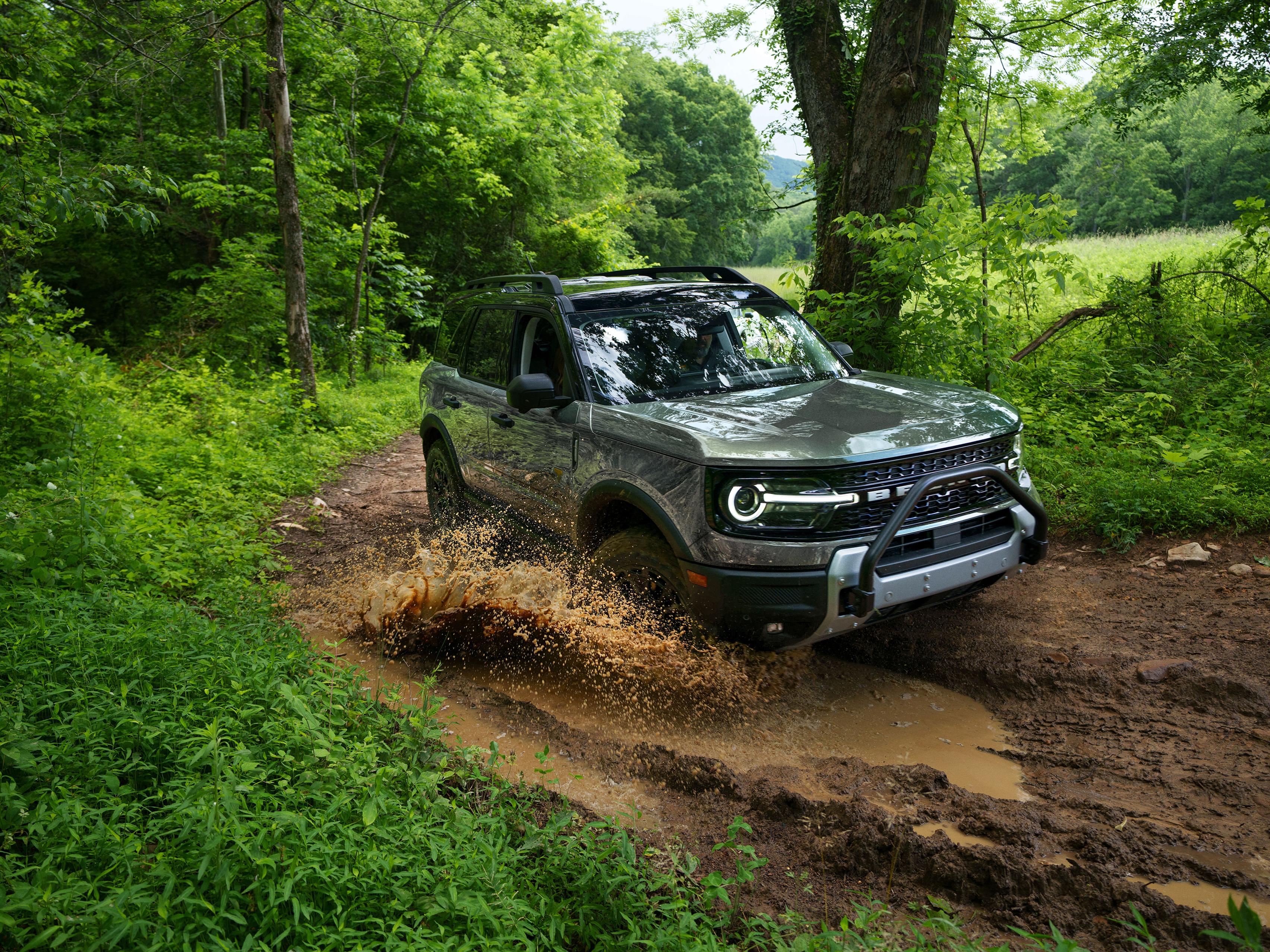 A 2026 Ford Bronco Sport® Badlands® SUV driving through mud