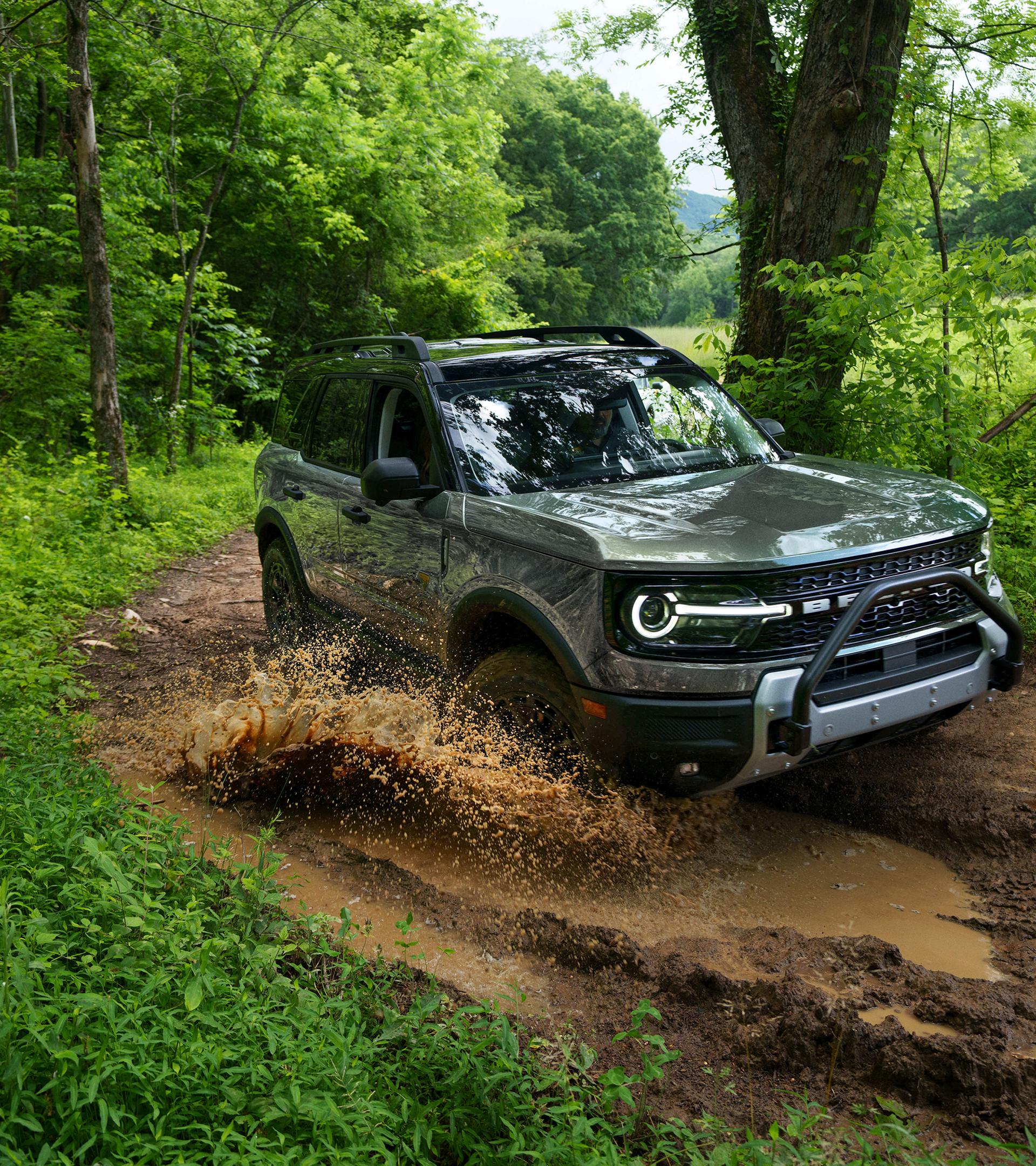 2026 Ford Bronco Sport® being driven on a dirt trail in the woods