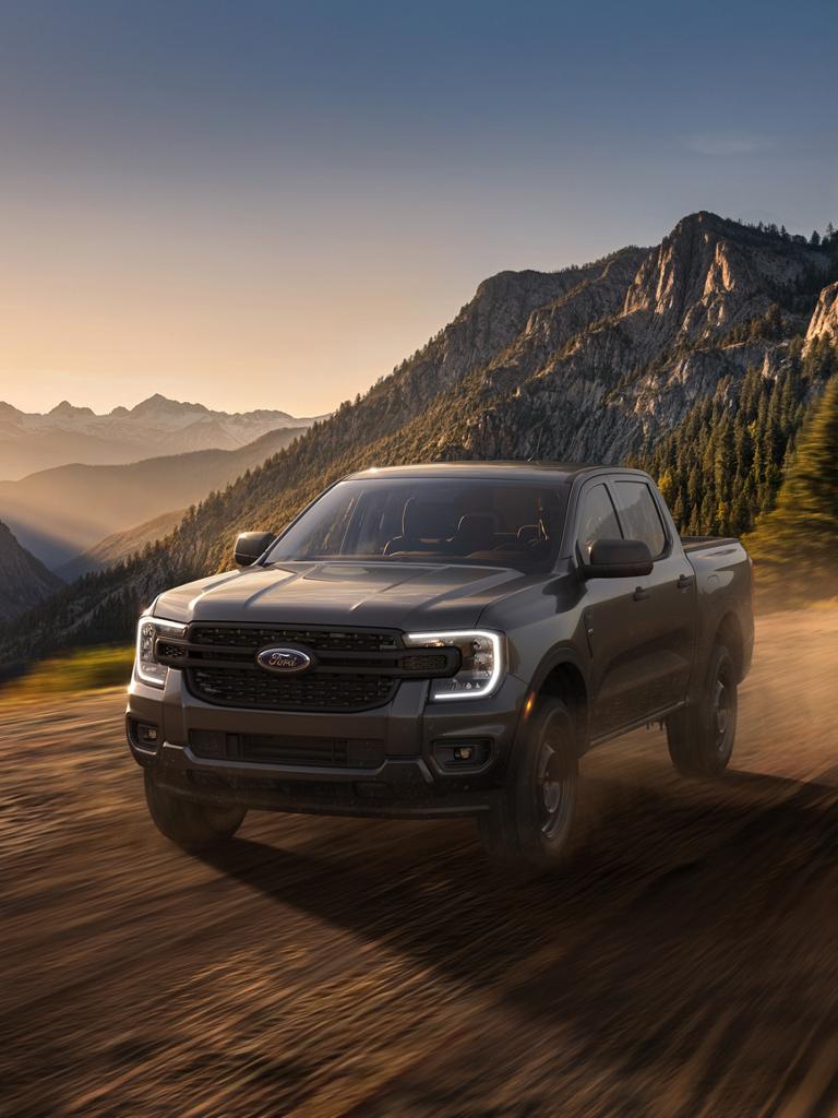 2026 Ford Ranger® XL model with the STX® appearance package being driven in the mountains