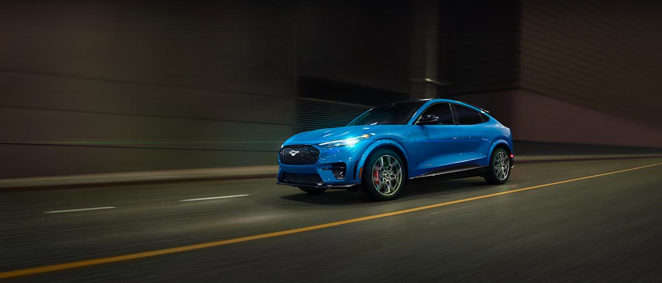 2025 Ford Mustang Mach-E driving down road