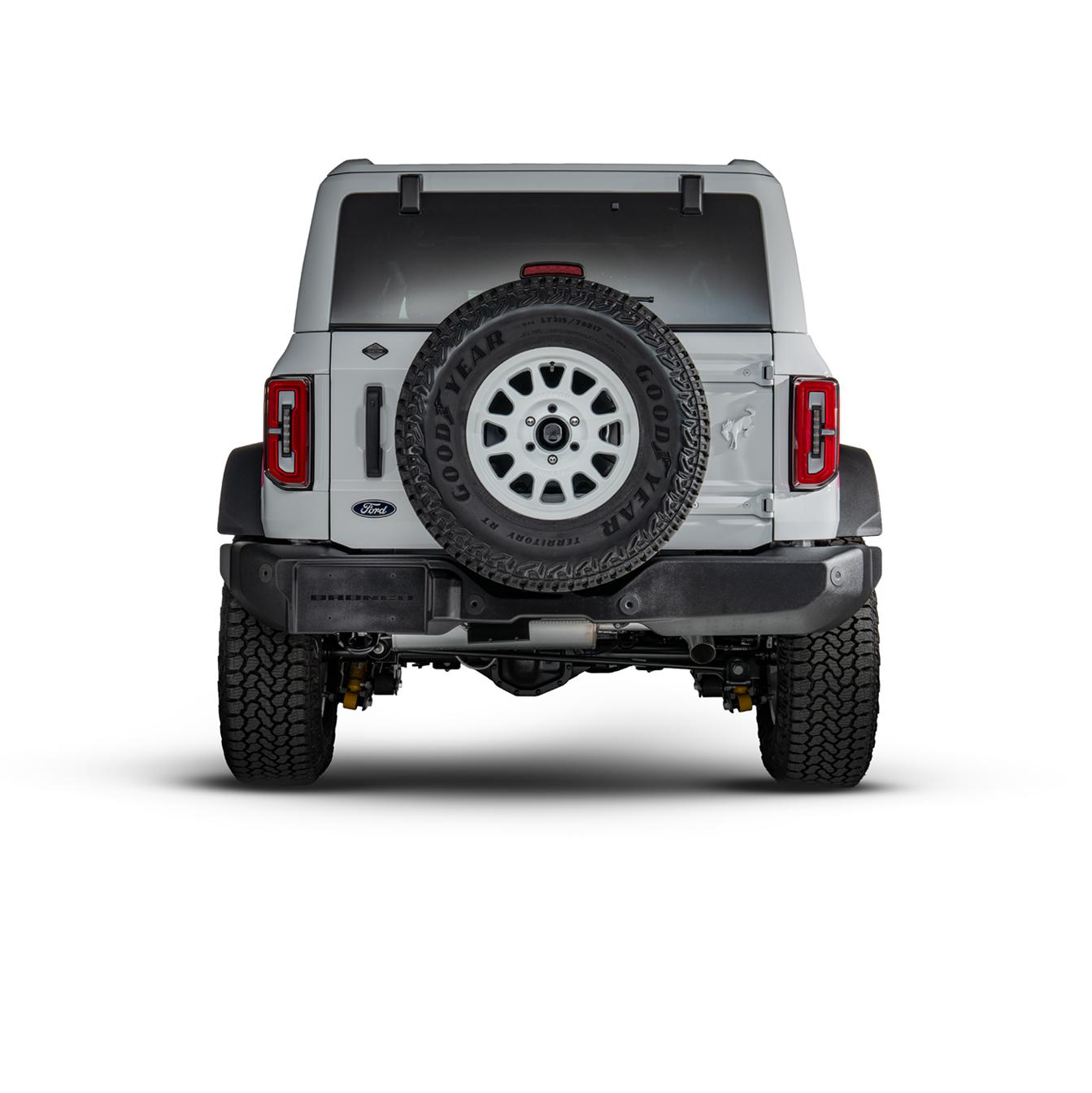 Rear view showing the tailgate, spare tire and painted Bronco badge